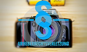Camera with in german Urheberrechtsverletzung in english Copyright infringement