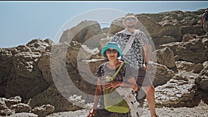 Camera getting closer to senior lady and adult son standing on hiking trail