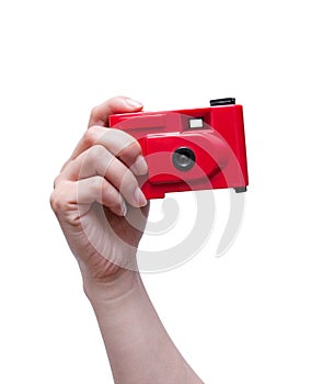 Camera in a hand isolated on white background