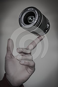Camera Lens Levitating on a Vinger