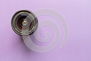 Camera lens on a purple background