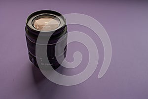 Camera lens on a purple background