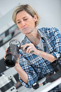 Camera lens repair set in photo engineer workshop