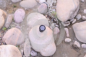 Camera Lens on Stone Nadaun Himachal Pradesh India photo