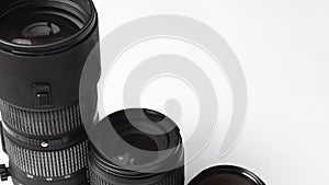 Camera lenses. photographer`s equipment. copy space. White background
