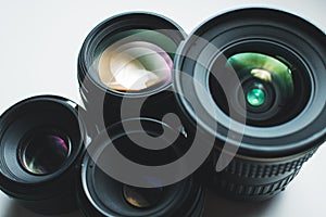 Camera lenses on a white surface