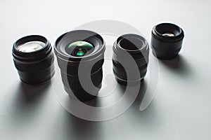 Camera lenses on a white surface