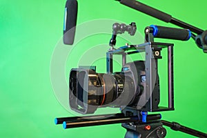 camera,microphone, lights and a green screen