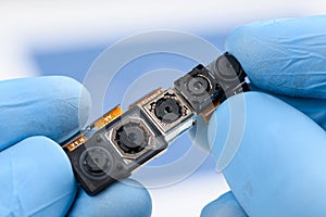 Camera modules with different sensor technology and resolution in scientist hands