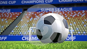 Camera move towards a soccer ball lying on grass in an empty stadium