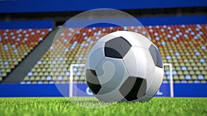 Camera move towards a soccer ball lying on grass in an empty stadium