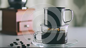 Camera movement antique coffee filter the filtered black coffee is poured into a clear glass