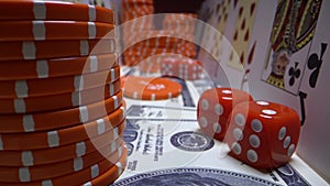 Camera moves above playing cards, dollars, chips, red dice. Super macro shot. Set for playing poker close up.