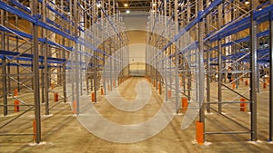 Camera Moves from Ceiling to Floor along Specious Warehouse