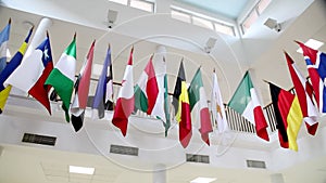 camera pan over many national flags hanged around the first floor