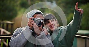 Camera, photographer and couple travel and explore holiday, adventure or vacation location and capture a moment. Getaway