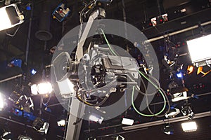 Camera record on crane in production on studio and light to stag