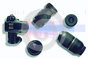 Camera and some lenses on a focal lenght graph. Photo and video technical concept. Top view and empty copy space