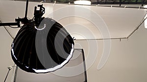Camera spotlight in big studio.