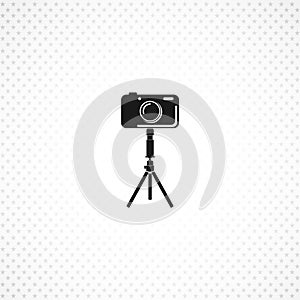 Camera on tripod isolated solid icon