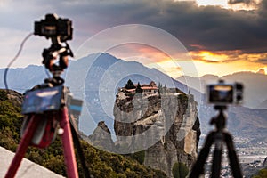 Camera on tripod and Meteora monasteries