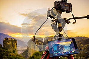 Camera on tripod and Meteora monasteries