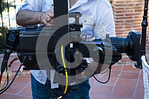 Cameraman checking equipment of camera in broadcast television