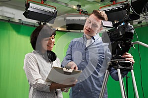 Cameraman And Floor Manager In Television Studio