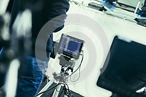 Cameraman operates a film camera, broadcasting studio