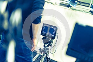 Cameraman operates a film camera, broadcasting studio