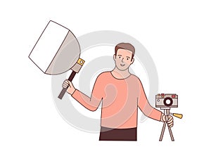 Cameraman with photographic equipment flat vector illustration. Professional photographer holding softbox and mirrorless