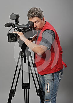 Cameraman in red vest