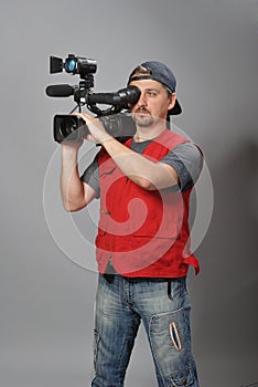 Cameraman in red vest