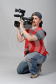 Cameraman in red vest