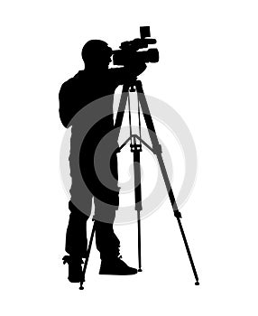 Cameraman silhouette with video camera.