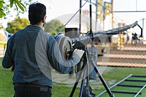 Cameraman working in a broadcast television virtual outdoors tv studio