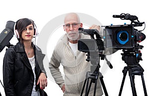 Cameraman and a young woman with a movie camera DSLR on white