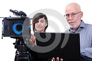 Cameraman and a young woman with a movie camera DSLR on white