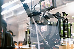 cameras and professional video camera on a tripod
