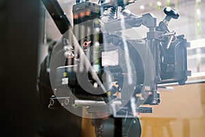 cameras and professional video camera on a tripod in a movie studio