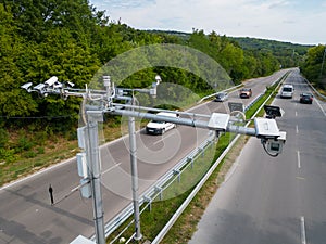 Cameras and speed control radars along a busy highway monitor and record speeding violations.