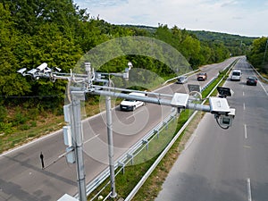 Cameras and speed control radars along a busy highway monitor and record speeding violations. photo