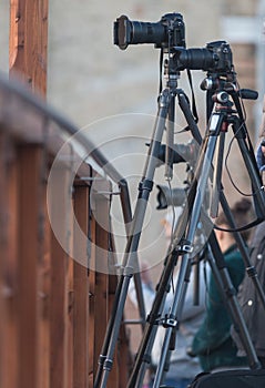 Cameras on tripods are on the bridge