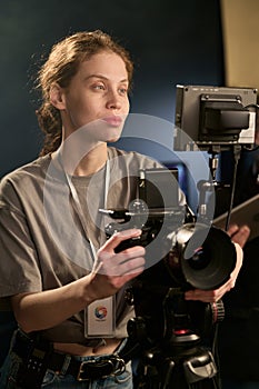 Camerawoman Operating Equipment on Set