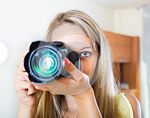 Camerawoman taking images indoor