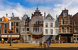 Cameretten central square of Delft with peculiar townhouses in summer day