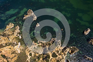 Camilo Beach in Lagos, Algarve - Portugal. Portuguese southern golden coast cliffs. Sunny day aerial view