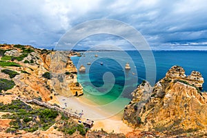 Camilo beach Praia do Camilo in Lagos, Algarve, Portugal. Wooden footbridge to the beach Praia do Camilo, Portugal. Picturesque