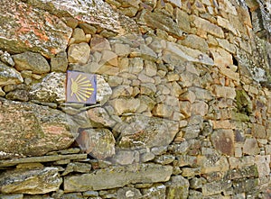Symbol of the Camino de Santiago in the Village of As Eiras towards the town of Laza, province of Orense, Spain photo