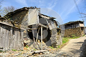 Galician rural architecture, ruined stone house in the village of As Eiras, Spain photo